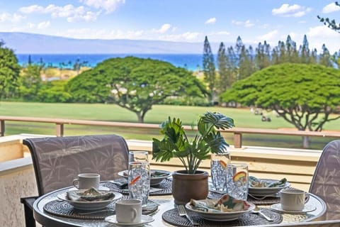 Relax at a beautifully set outdoor table with breathtaking island views.