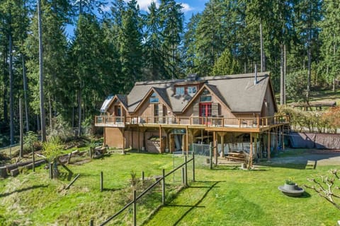 Located on the right side of home with the red doors.