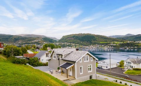 A luxury home nestled in the mountains with stunning views over Hardangerfjord