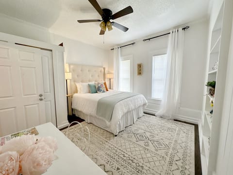 Queen bed and vanity desk
