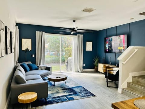 Huge TV living room open concept, sliding door leads to pool area! 