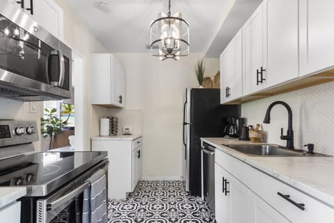 Kitchen: Whip up delicious meals in this stylish space with modern appliances and chic décor!