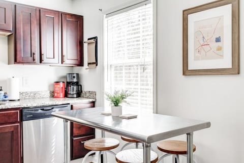 Along with the dining table, we have additional seating at a bar in the kitchen.