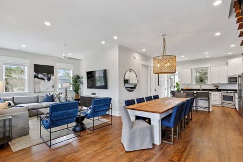 Dining Area | Open Concept Dining Area with Chandelier Connected to Living Room and Kitchen | Main House — First Floor