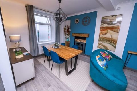 Living room with dinning area heating, WiFi,  log burner and electric fire and smart TV 