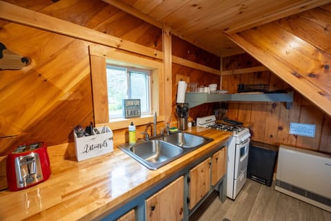 Cook your favorite meals while enjoying the charm of natural wood all around.