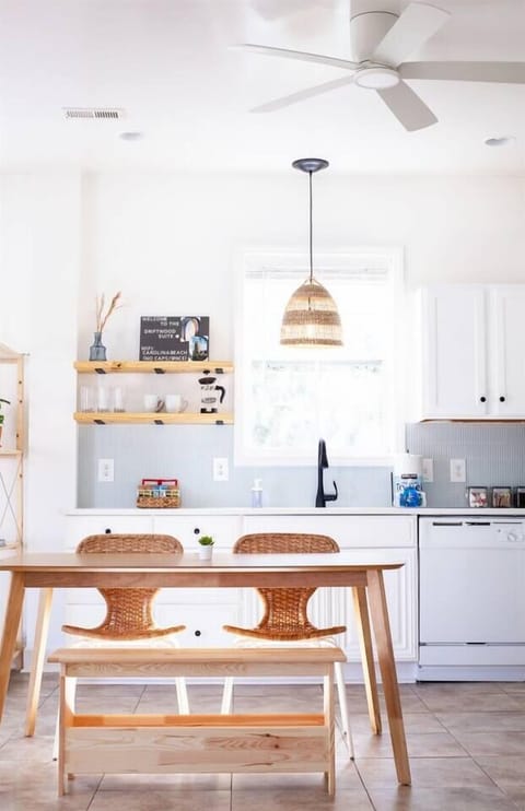Dining table with seating for four. Plenty of space to enjoy a meal, play games, or work remotely