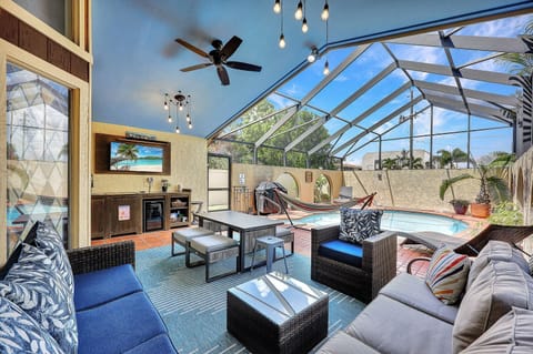 Heated Saltwater Pool/Lanai, lounge chairs, hammock, grill, TV/Sound bar, wine fridge, sink, dining. (2)