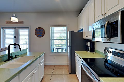 Condo, 1 Queen Bed, Balcony (#214E) | Private kitchen | Fridge, microwave, oven, stovetop