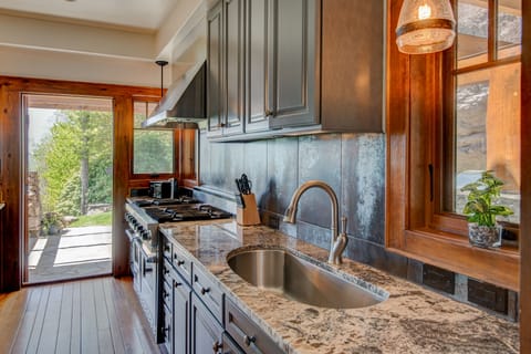 Spacious Kitchen Leading out to the the Stone Patio