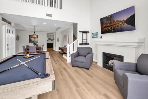 Welcome home! Pool table, flat screen TV, access to the front patio - what more do you need? The fireplace is non-operable.