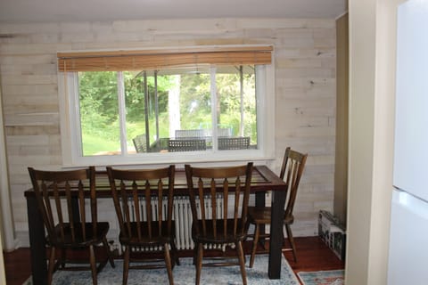 Newly renovated dining room. More seating in sunroom.