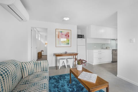 Standard Apartment | Living area | 50-inch flat-screen TV with digital channels
