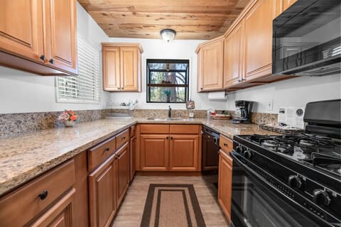 A fully stocked kitchen with plenty of kitchenwares, seasonings and more to cook for the family.