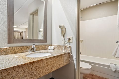 Superior Room, 1 King Bed (Smoke Free) | Bathroom | Combined shower/tub, free toiletries, towels