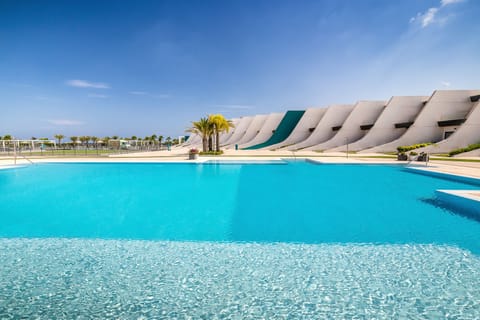 Seasonal outdoor pool, open 10:30 AM to 8:30 PM, pool umbrellas