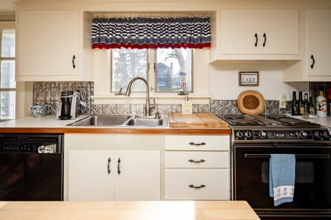 Keurig coffee maker, toaster oven, electric oven range and dishwasher.