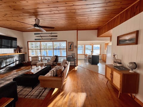 Panoramic windowed views feel like a treehouse overlooking the water.