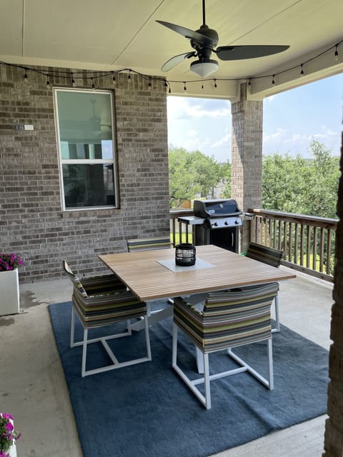 Back patio with outdoor fan.