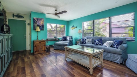 Living Room has Plenty of Light and Comfortable Seating