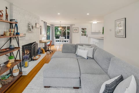 Bright and inviting living/dining area with a comfy sectional, perfect for relaxing after a day of exploring