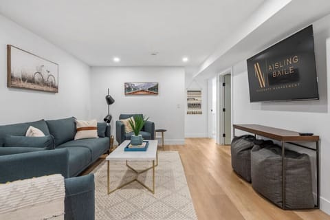 Living room with a Smart TV and cozy seating options.
