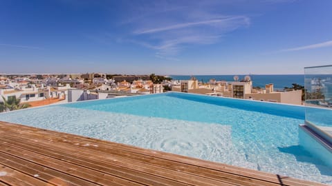 Our stunning rooftop swimming pool with panoramic views of the city. #algarve #pool #summer #airbnb
