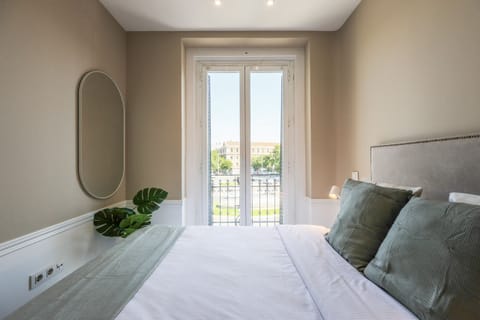 View of the bedroom with double bed and exterior balcony