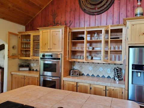 Fully stocked kitchen with 20+ place settings, special glassware.
