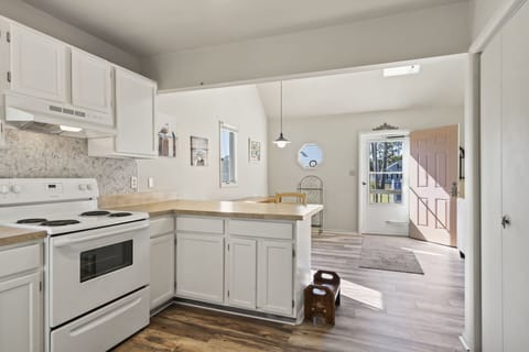 Beachy White Cabinetry and so well stocked!