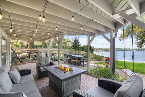 Backyard patio with firepit table, dining table, giant Jenga, and SUNSET VIEWS!