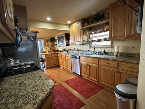 Built in radio under counter, built in microwave above gas stove.  