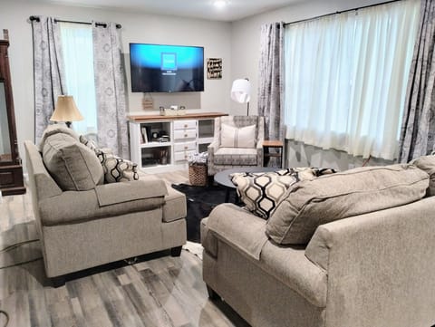 Living room - comfy seating for 6, 60" Roku Smart TV. Wifi throughout the home.