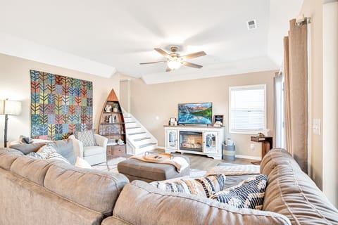 Beautiful quilt work compliments the rustic lake feel of the living area