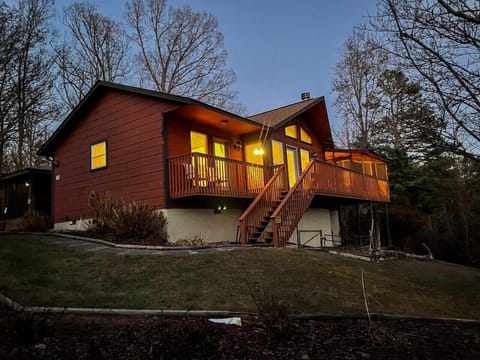 Welcome to Serenity View — a single-level cabin glowing warm at dusk
