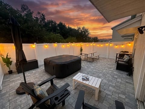 Patio with hot tub and grill