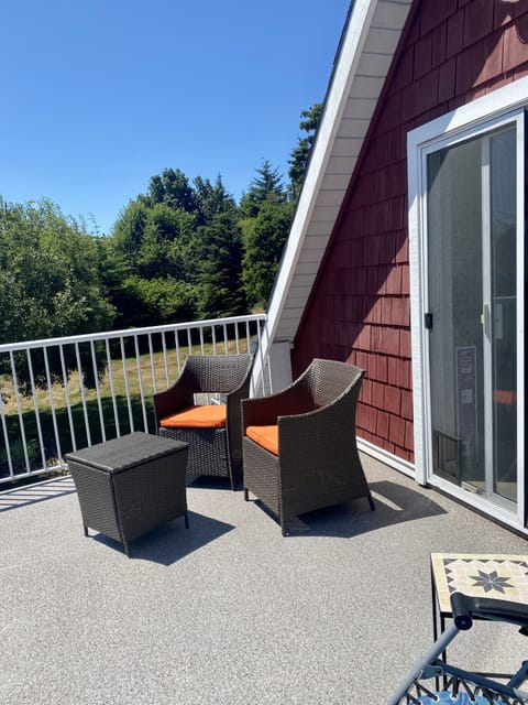 Porch surrounded by private lawns and a view