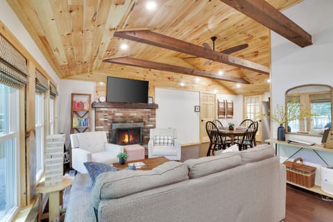 “Warm, open living space with vaulted wood ceilings—perfect for relaxing!