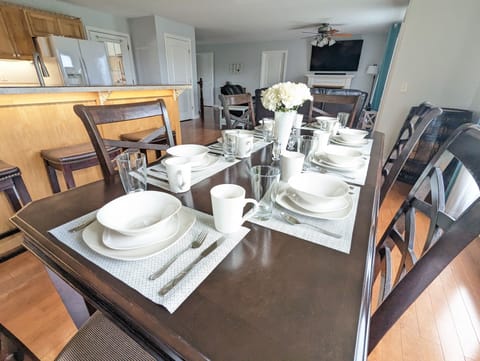 Dining table with additional seating at the bar.
