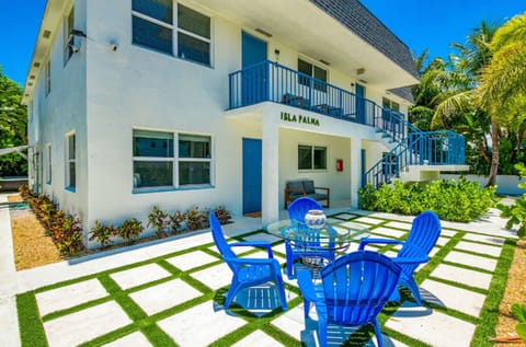 Enjoy outdoor meals and sea breeze at this shared courtyard patio after beach