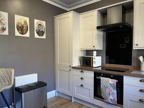 Large kitchen with lots of cupboard space and all appliances you may need.