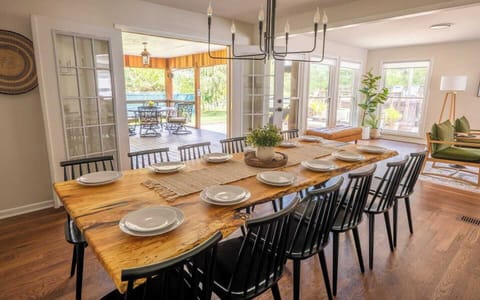 2 sets of French doors off the dining room seamlessly connect the outdoor and indoor dining and living area. An open floor plan allows guests to easily flow from one space to another, with many smaller conversation areas to connect. 