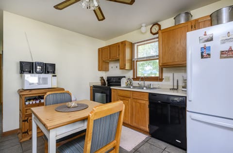 Enjoy all the comforts of Home in the well-stocked Kitchen that leads to the Screened Porch.