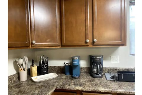 Coffee pots, toaster oven, cookware, blender - well stocked.