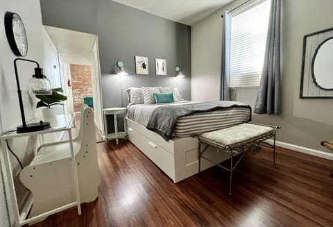 Comfy queen bed with extra linens and storage underneath bed