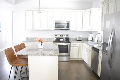 You’ll have plenty of counterspace, including in the kitchen island, plus all the cookware, bakeware, dishware, flatware, glassware, serving-ware, and utensils you need for your favorite recipes. Barstools provide supplemental dining seating.