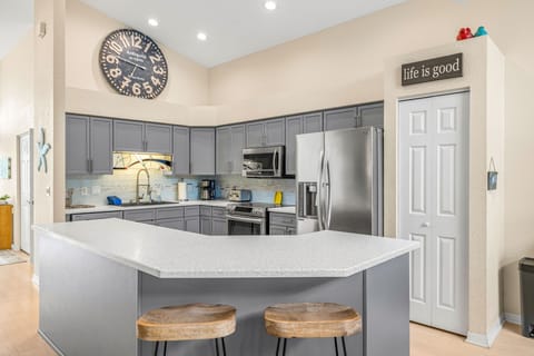 Stainless steel appliances and nice kitchen island with additional seating