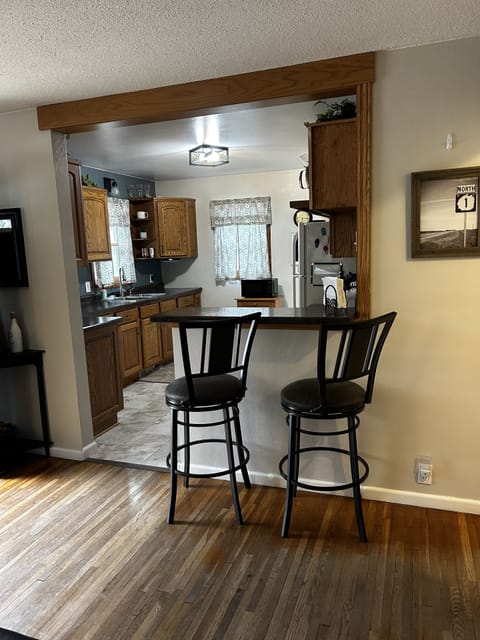 Breakfast bar between kitchen and living room