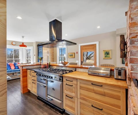 Brand new updated & modern kitchen. Slate and butcher block countertops and bar seating for 8. Fully equipped for all of your cooking needs, including a AGA propane stove, zavor quick pot and kitchen aid stand mixer.