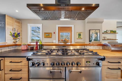 Brand new updated & modern kitchen. Slate and butcher block countertops and bar seating for 8. Fully equipped for all of your cooking needs, including a AGA propane stove, zavor quick pot and kitchen aid stand mixer.